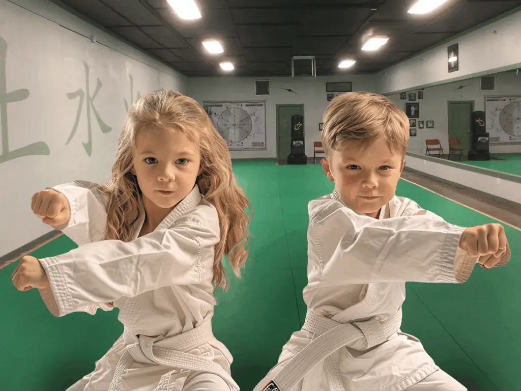 Two children practicing karate in the Bushido of Benson dojo